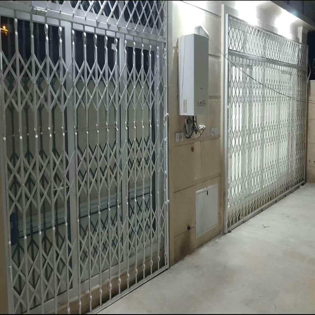 درب آکاردئونی حفاظ ساختمان در بیرجند
